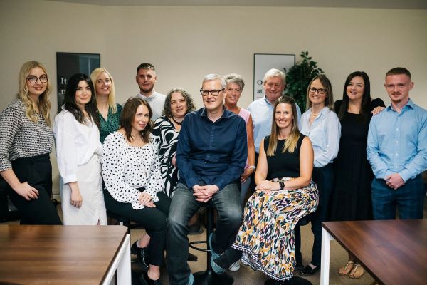 Tony Garner, centre, with the Viva team 600 x 400 Tony Garner with the Viva Team